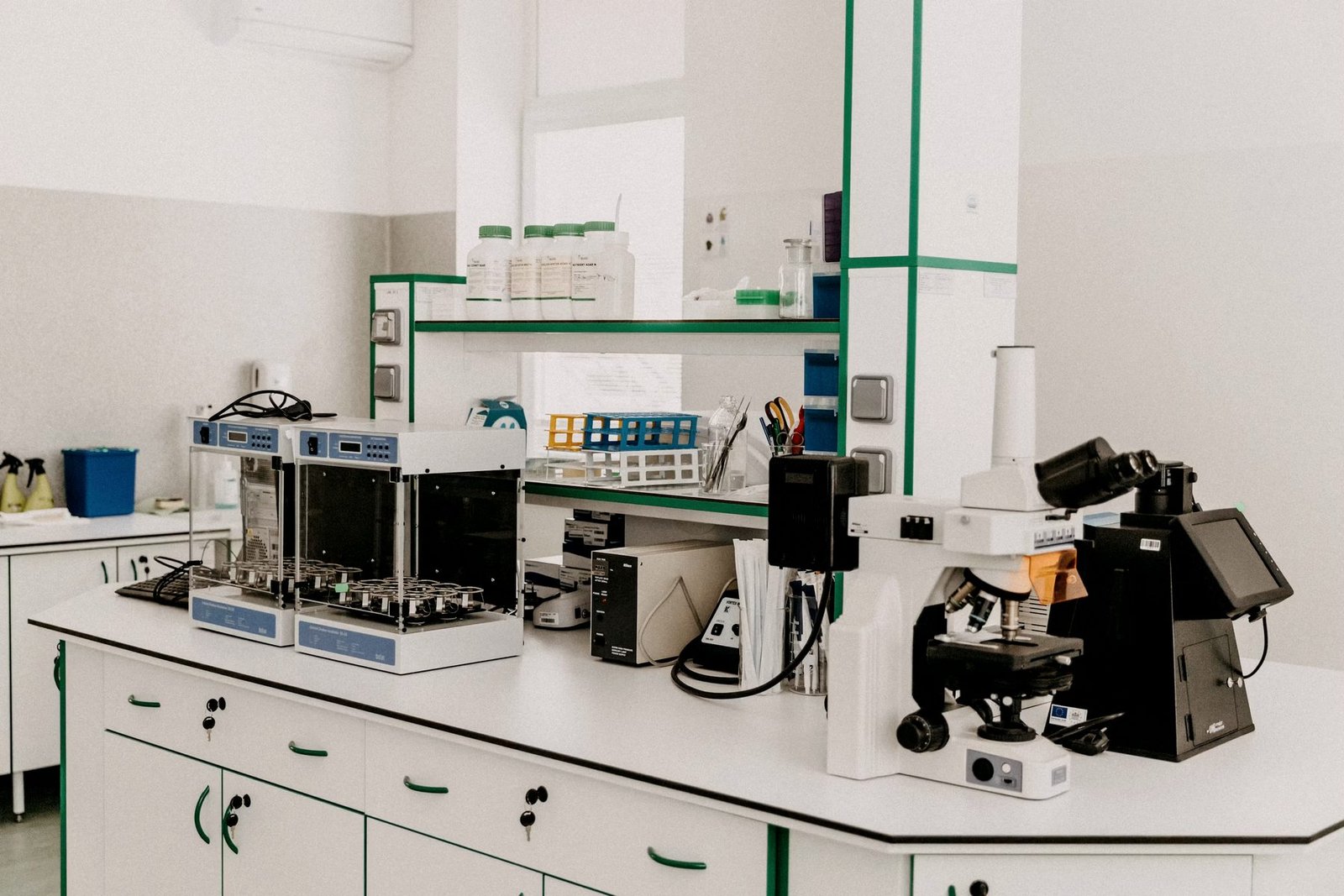 A laboratory workbench with a microscope and sample preparation equipment